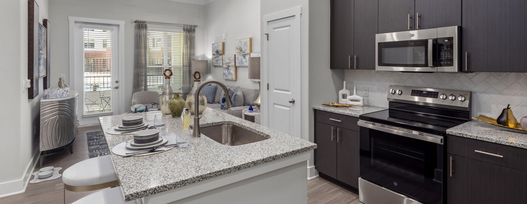 a kitchen with black cabinets