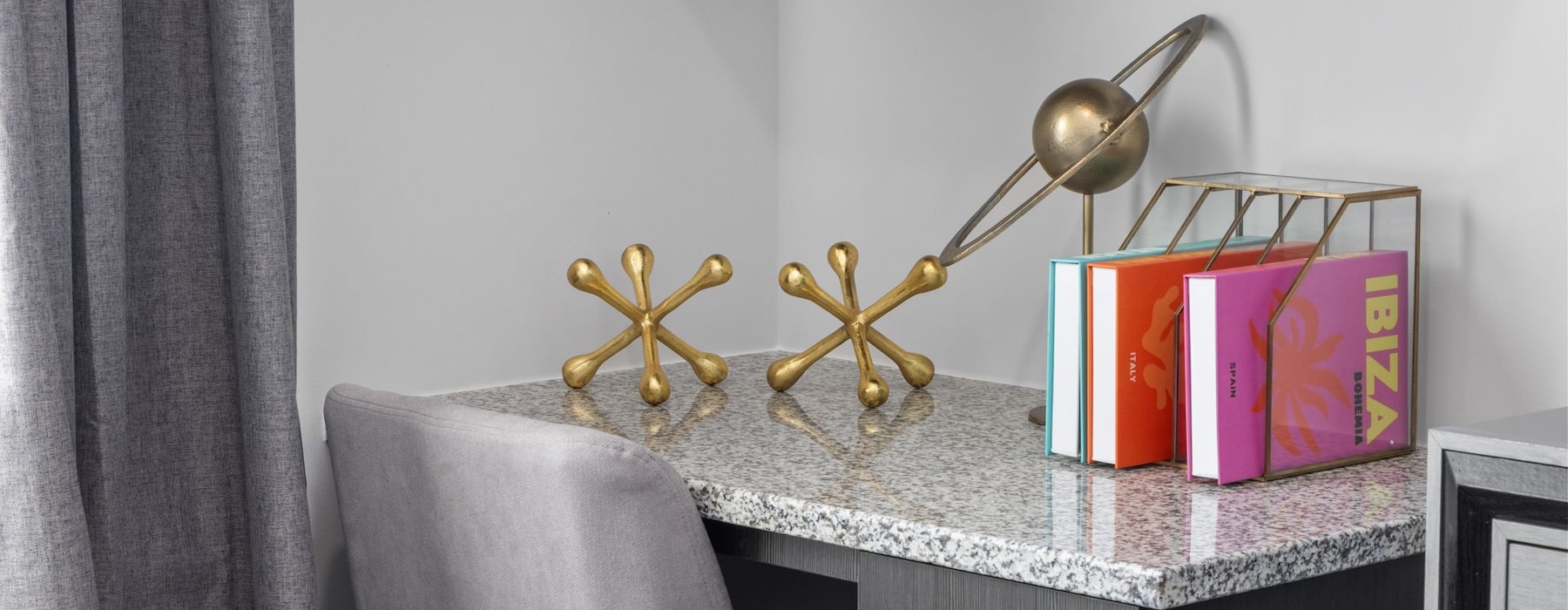 a bedroom with a desk and a chair