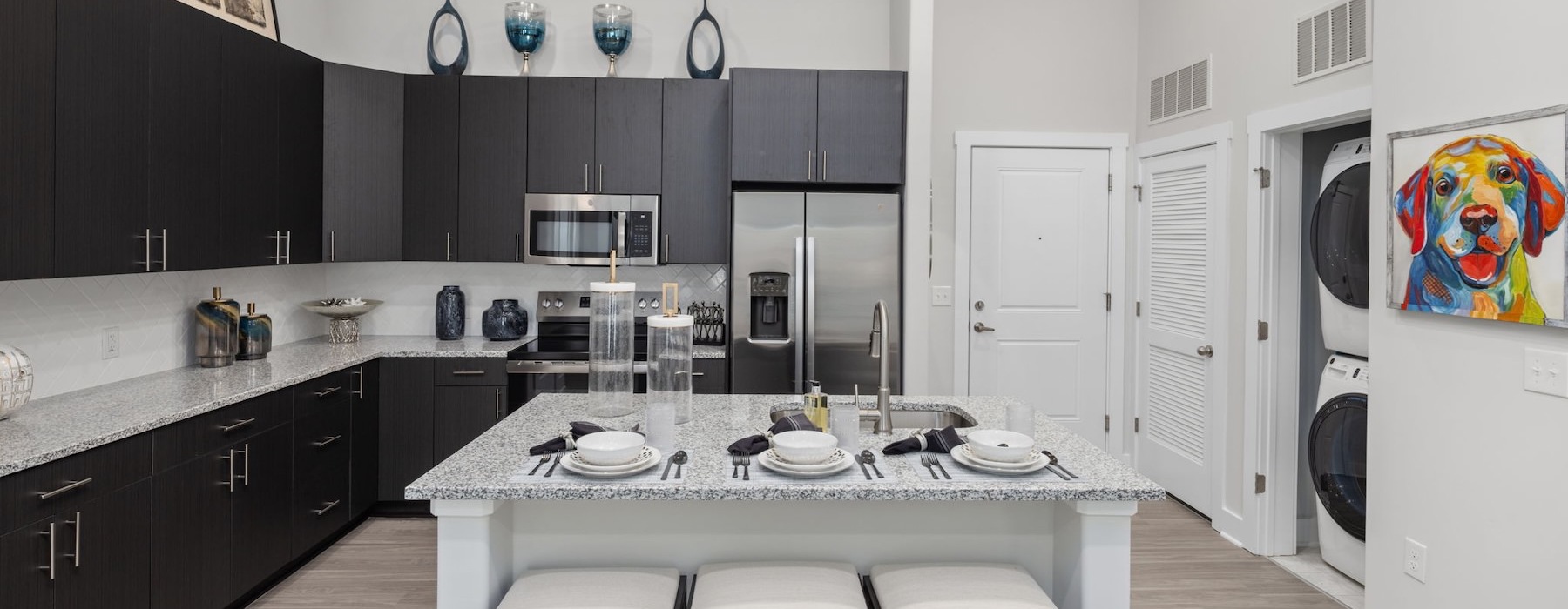a kitchen with a bar and stools