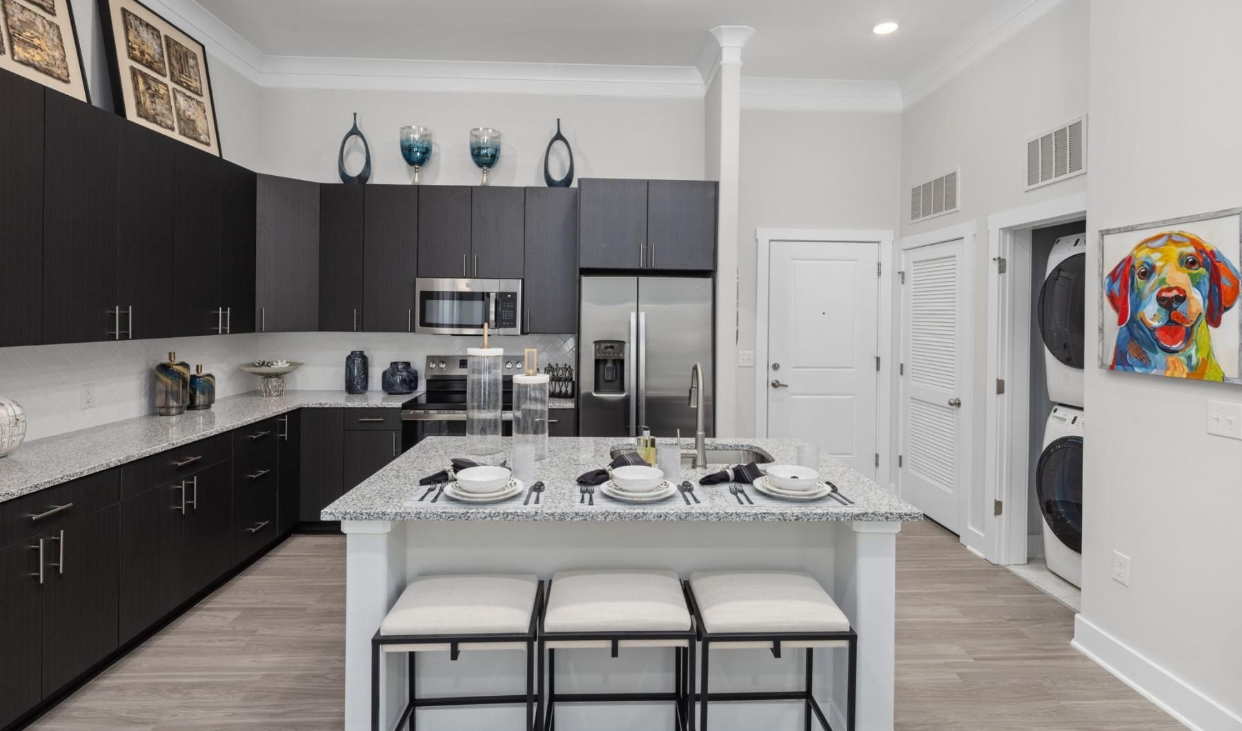 a kitchen with a bar and stools